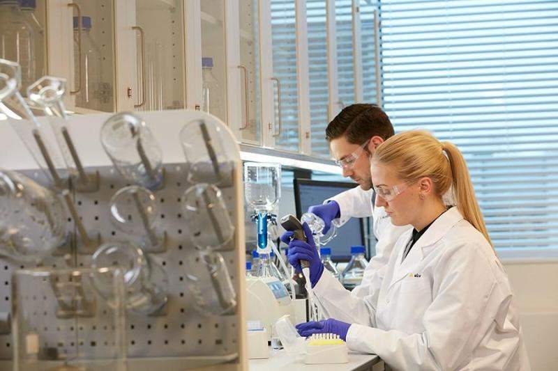male and female scientists working in lab